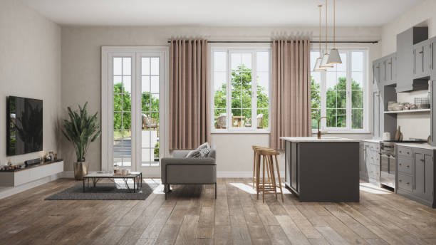 Side View Of Open Plan Kitchen With Living Room And Garden View From The Window