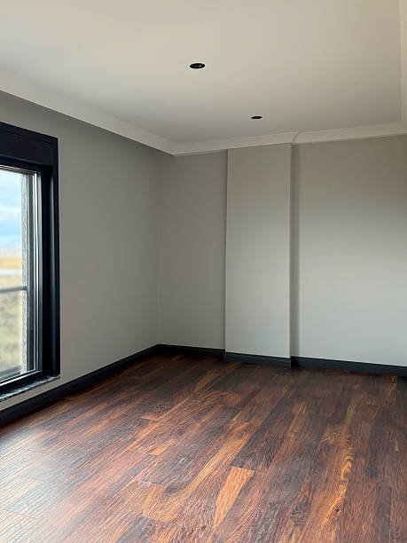 Empty room. Empty domestic bedroom or living room with parquet floor and window